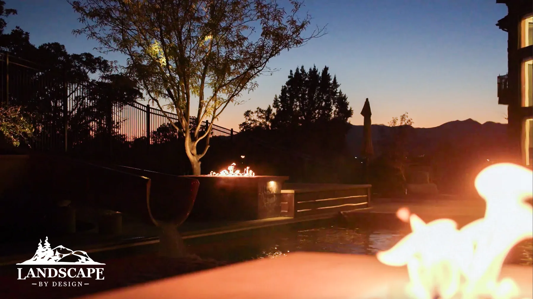 Dual fire features create symmetry and drama, extending the season for outdoor entertaining.