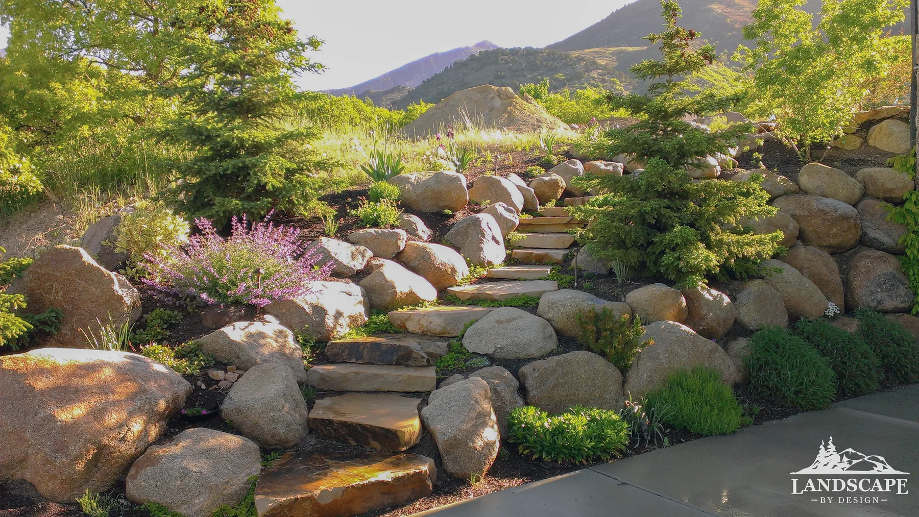 Natural boulder steps integrated into the hillside terrain.
